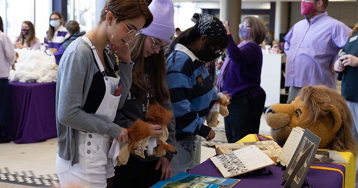 Students look at historical images of campus during the Stuff-A-Lion event at UNA Founders' Day 2022.